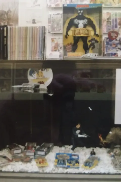 A close-up of another display case at Rocket Comics. Look at that cool Rancor figure from Kenner!