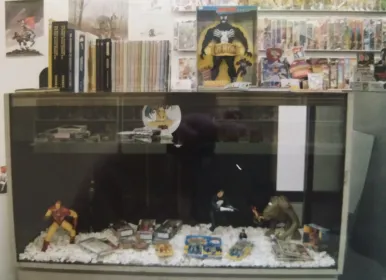 A close-up of another display case at Rocket Comics. Look at that cool Rancor figure from Kenner!