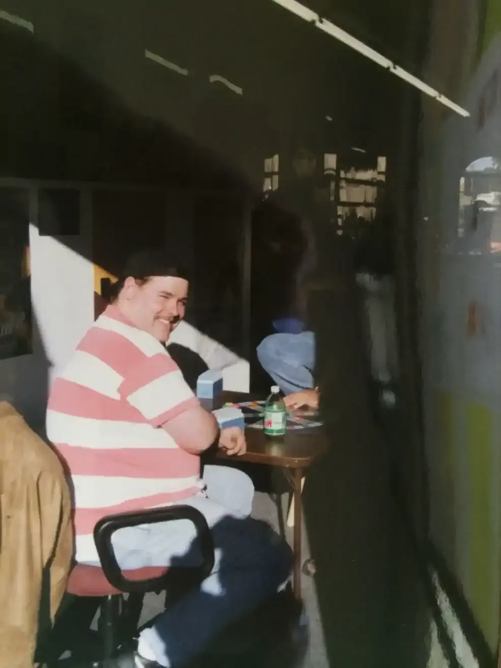 Playing Trivial Pursuit on a break with long time friend, Lynn. Mack is hiding in the shadows...like Batman.